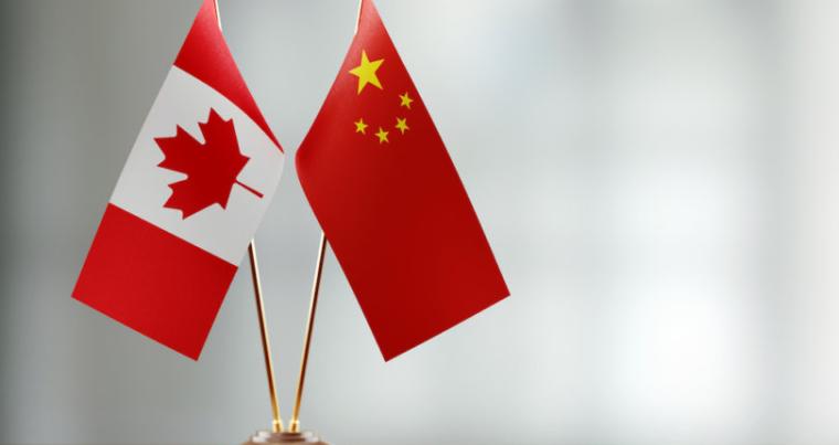 China-flag-canada-flag-810x500.jpeg