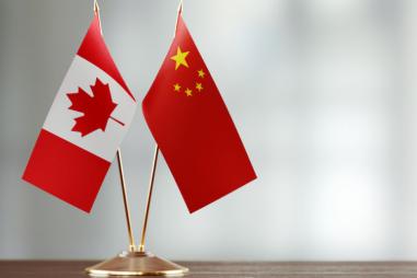 China-flag-canada-flag-810x500.jpeg