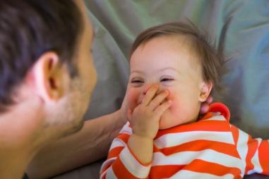 happy-baby-with-down-syndrome-810x500.jpg