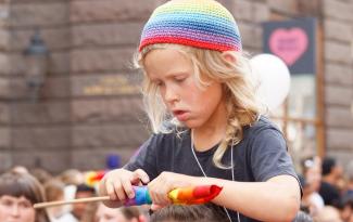Swedish_boy_at_pride_parade.jpg